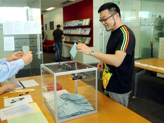 A French Shanghai resident cast his ballot at a polling station for the 2012 French presidential election in Shanghai. French voters headed to the polls on April 22 for the first round of a presidential election that is expected to mark the end of Nicolas Sarkozy's turbulent term in office. AFP/Peter Parks