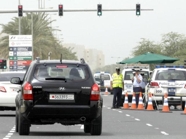 Police officers man a checkpoint outside the Formula One Bahrain International Circuit in Sakhir, Bahrain. (AP Photo/Hassan Ammar)