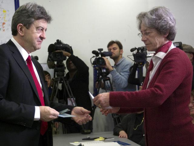 Front de Gauche (FG) leftist party's candidate for the 2012 French presidential election Jean-Luc Melenchon is about to cast his ballot in a polling station in Paris, as part of the 2012 French presidential election first round vote. AFP/POOL