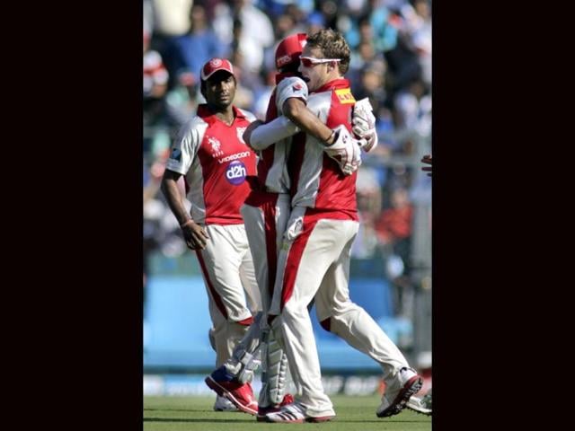 Kings XI Punjab player David Miller (R) celebrates the wicket of Mumbai Indians batsman Sachin Tendulkar during their IPL cricket match in Mumbai. (AP Photo/Rajanish Kakade)