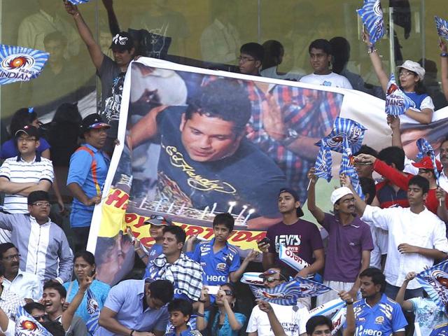 Fans cheer holding Sachin Tendulkar's poster during the match between Kings XI Punjab and Mumbai Indian at Wankhede Stadium, Mumbai. (HT PhotoKunal Patil)