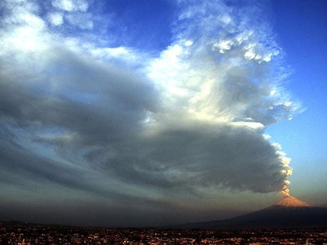 A plume of ash and steam rise from Popocatepetl Volcano seen from San Andres Cholula, Mexico. AP Photo