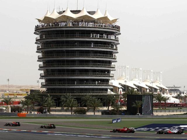Red Bull driver Mark Webber of Australia, leads, Lotus driver Romain Grosjean of France, Ferrari driver Fernando Alonso of Spain, and McLaren Mercedes driver Jenson Button of Britain during the Bahrain Formula One Grand Prix at the Formula One Bahrain International Circuit in Sakhir, Bahrain. (AP Photo/Luca Bruno)