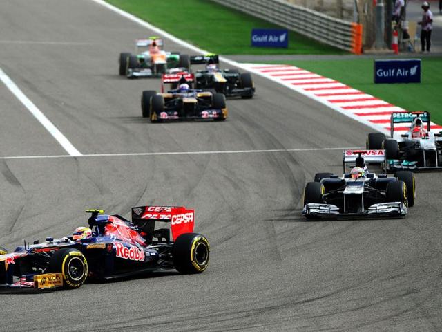 (L to R) Scuderia Toro Rosso's French driver Jean Eric Vergne, William's Venezuelan driver Pastor Maldonado and Mercedes' German driver Michael Schumacher compete at the Bahrain international circuit in Manama during the Gulf kingdom's Formula One Grand Prix. (AFP Photo/Tom Gandolfini)
