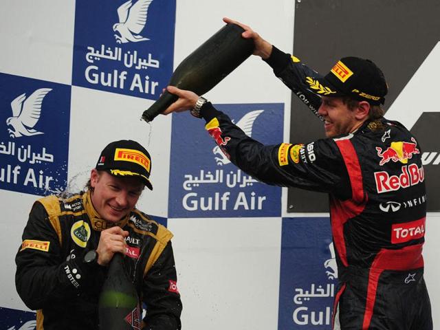 Red Bull Racing's German driver Sebastian Vettel celebrates on the podium at the Bahrain International circuit in Manama after the Bahrain Formula One Grand Prix. (AFP Photo/Dimitar Dilkoff)