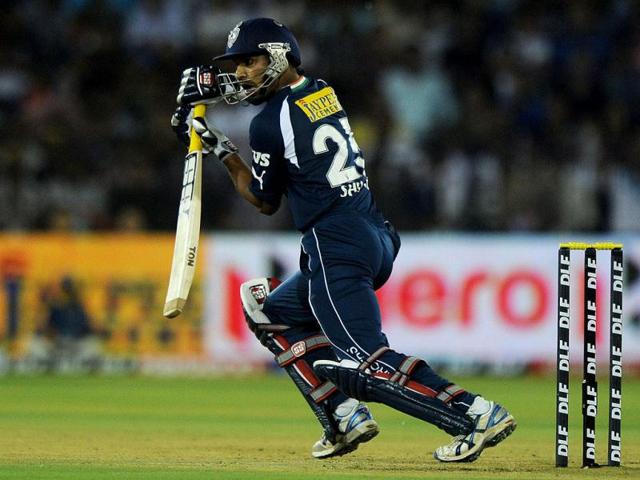 Deccan Chargers batsman Shikhar Dhawan plays a shot during at the Barabati Stadium in Cuttack. (AFP Photo/Dibyangshu Sarkar)
