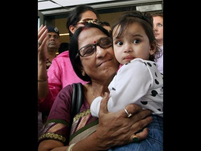 Aishwarya is carried by her grandmother on her arrival at IGI airport in New Delhi. NRI children Aishwarya and Abhigyan arrived from Norway, where they were kept in foster care for nearly a year. PTI/Atul Yadav