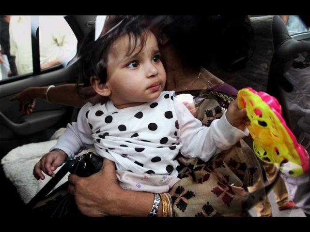 Aishwarya in the lap of her grandmother on her arrival at IGI airport in New Delhi. NRI children Aishwarya and Abhigyan arrived from Norway, where they were kept in foster care for nearly a year. PTI/Atul Yadav