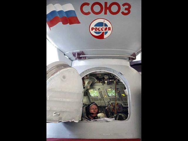 Member of the next expedition to the International Space Station, Russian cosmonaut Genady Padalka, sits inside a mock-up of a Soyuz TMA space craft during the final preflight practical examination at Russian Space Training Center in Star City outside Moscow.(AP Photo/Mikhail Metzel)