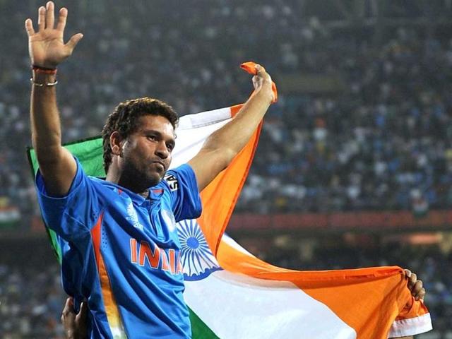 (File) Sachin Tendulkar waves the tricolour while celebrating victory during the final of ICC Cricket world Cup 2011 match between India and Sri Lanka at the Wankhede Stadium in Mumbai. Sachin Tendulkar turned 39, with an impassioned plea from his childhood coach to carry on playing cricket for India since he is "far from finished". AFP/Prakash Singh