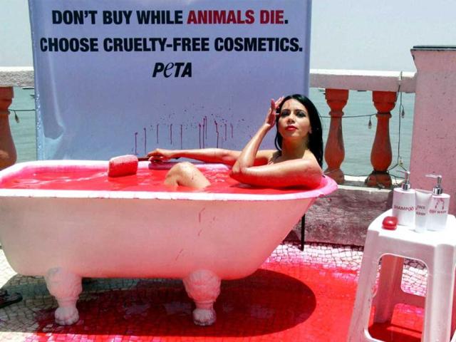 Posing for PETA, model Rozlyn Khan takes bath in blood-red water to protest against cosmetic testing on animals, in Mumbai. (PTI)