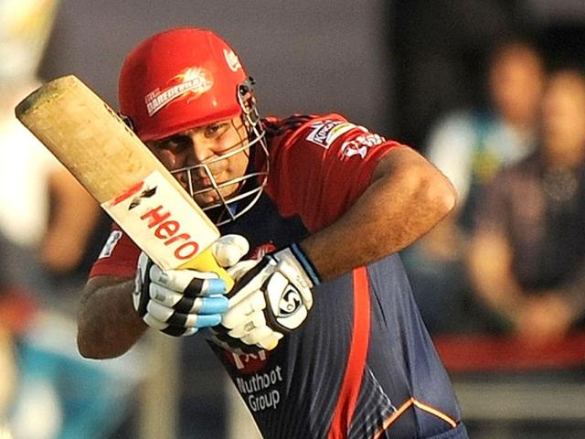 Delhi Daredevils captain Virender Sehwag plays a shot during the IPL Twenty20 cricket match in Pune. (AFP Photo/Punit Paranjpe)