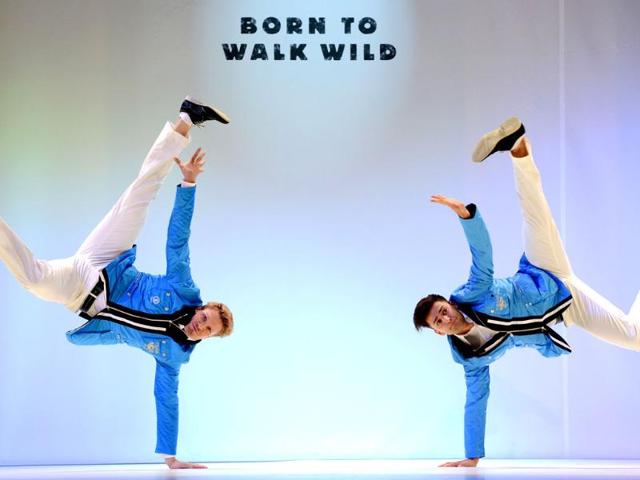 Members of the German Olympic team for London 2012 and models present the official team clothes on the fairground in Duesseldorf , Western Germany. (AFP photo/PATRIK Stollarz)