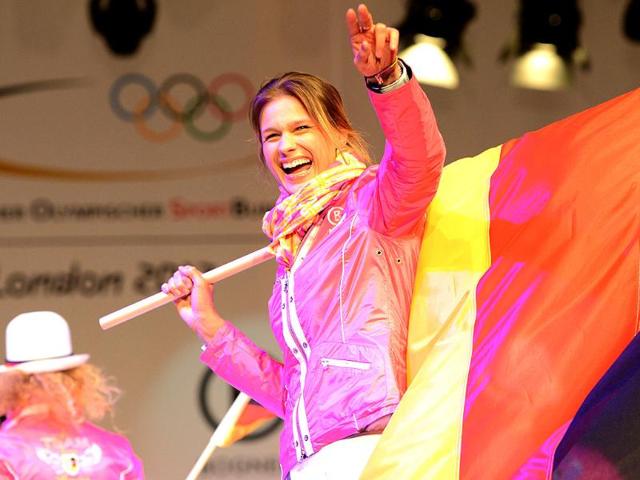 Fencing champion Britta Heidemann, member of the German Olympic team for London 2012 walks down the catwalk during the press presentation of the official team clothes on the fairground in Duesseldorf , Western Germany. (AFP photo/PATRIK Stollarz)