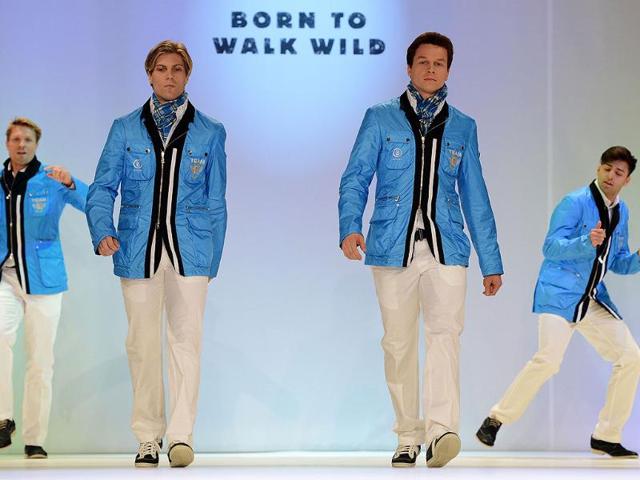 Members of the German Olympic team for London 2012 and models walk down the catwalk during the press presentation of the official team clothes on the fairground in Duesseldorf , Western Germany. (AFP photo/PATRIK Stollarz)