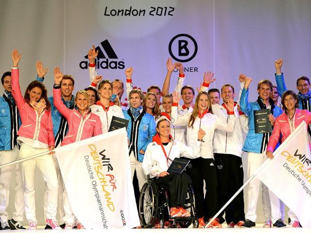 Members of the German Olympic team pose for a picture during the press presentation of the official team clothes on the fairground in Duesseldorf , western Germany. (AFP photo/PATRIK Stollarz)