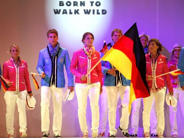 German fencing champion Britta Heidemann (C) and athletes present the official uniforms of the German Olympic team for the 2012 Olympic Games in Duesseldorf. (Reuters/Ina Fassbender)