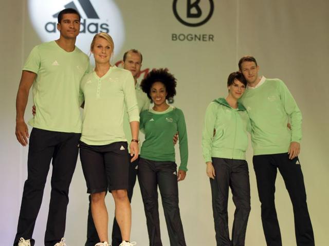 German Olympic team members present the new team fashion for the upcoming London 2012 Olympic Games in Duesseldorf, Germany. (AP Photo/Frank Augstein)