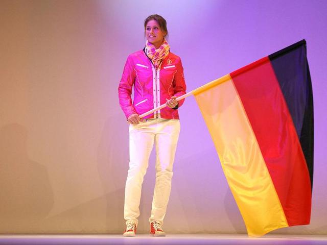 German fencing champion Britta Heidemann presents the official uniforms of the German Olympic team for the 2012 Olympic Games in Duesseldorf. (Reuters/Ina Fassbender)
