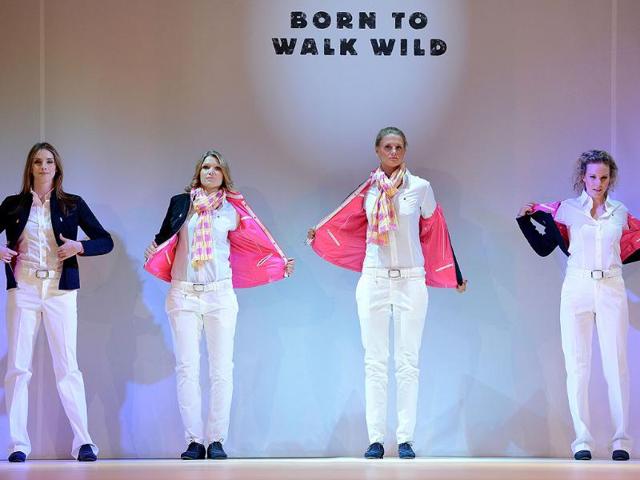 Members of the German Olympic team for London 2012 and models walk down the catwalk during the press presentation of the official team clothes on the fairground in Duesseldorf , Western Germany. (AFP photo/Patrik Stollarz)