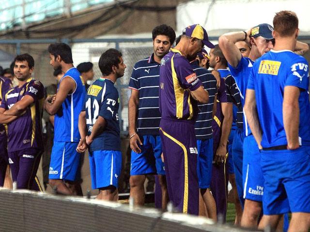 Deccan Chargers and KKR players wait for water to be cleared from Eden Garden in Kolkata. (PTI PhotoSwapan Mahapatra)
