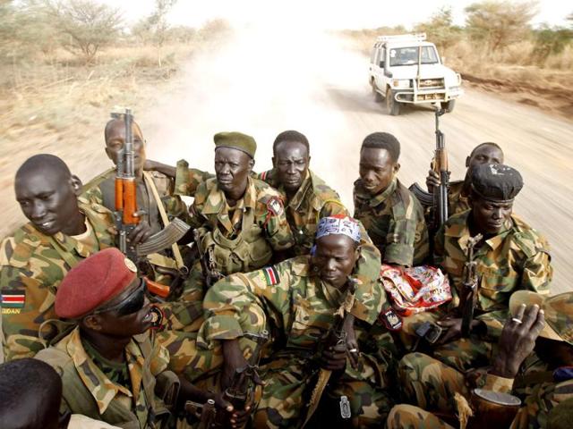 South Sudan's army, or the SPLA, soldiers drive in a truck on the frontline in Panakuach, Unity state. Reuters/Goran Tomasevic