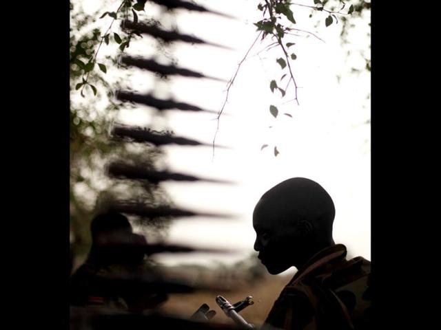 A South Sudan's army, or the SPLA, soldier sits in a truck on the frontline in Panakuach, Unity state. Reuters/Goran Tomasevic