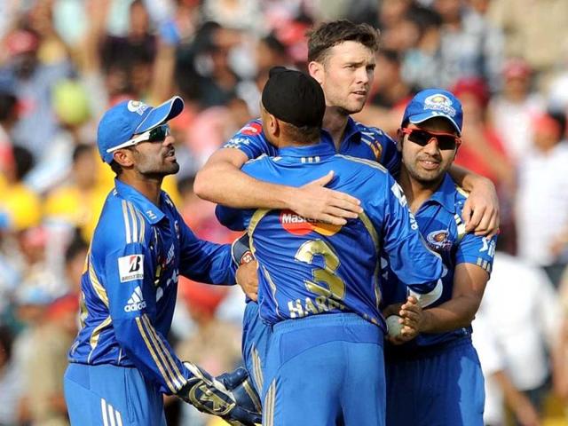 Mumbai Indians James Franklin (C) celebrates the wicket of Kings XI Punjab batsman Shaun Marsh with teammates during the IPL Twenty20 cricket match between Kings XI Punjab and Mumbai Indians at PCA Stadium in Mohali. AFP Photo/Prakash Singh