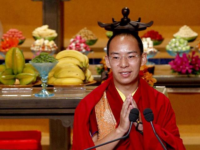 Gyaltsen Norbu, the Chinese government-appointed 11th Panchen Lama, speaks during an opening ceremony of the 3rd World Buddhist Forum in Hong Kong. (AP Photo/Kin Cheung)