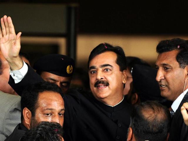 Pak PM Yousuf Raza Gilani waves upon his arrival at the Supreme Court building in Islamabad. Gilani was convicted of contempt of court by the country's highest court but avoided a jail term. AFP Photo/Aamir Qureshi