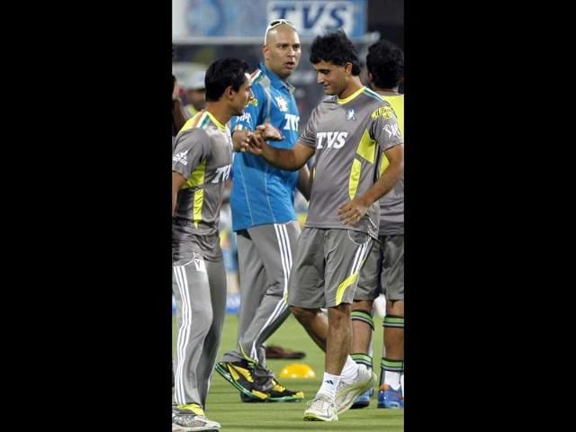 Yuvraj Singh is greeted by Pune Warriors captain Sourav Ganguly during his team visit on the ground before the match between Pune Warriors and Deccan Chargers at Subrata Roy Sahara Stadium in Pune. HT photo by Santosh Harhare.