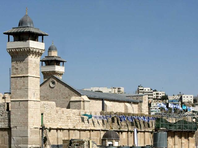 The Ibrahimi Mosque or the Tomb of the Patriarchs, in the old quaters of the southern West Bank city of Hebron, is decorated for the first time by Israelis with Israeli flags to mark the 64th anniversary of Israel's Independence. AFP/Hazem Bader