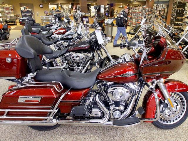 A file photo of Harley-Davidson motorcycles are for sale in the show room of Hall's Harley-Davidson Cycles in Springfield. (AP Photo/Seth Perlman)