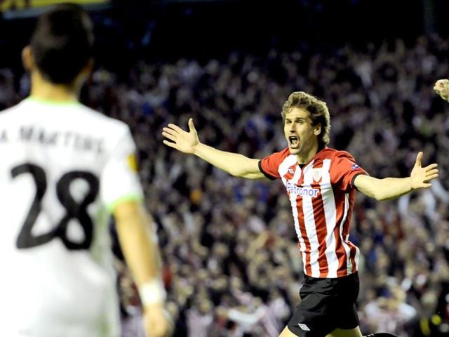 Athletic Bilbao's Fernando Llorente celebrates after he scored against SCP Sporting during their Europa League second leg, semifinal soccer match, at San Mames stadium in Bilbao, northern Spain. Athletic Bilbao won 3-1. (AP Photo/Alvaro Barrientos)