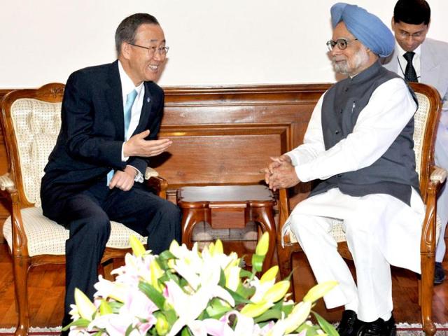 In this handout photograph released by the Prime Minister's Office Photo Division, United Nations Secretary General Ban Ki-moon talks to Prime Minister Manmohan Singh during a meeting in New Delhi. Ban is in India for a three-day official visit. AFP/PMO Photo Division