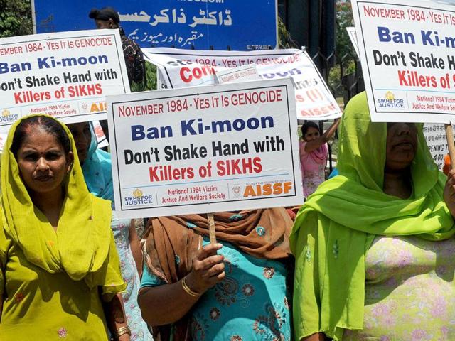 Relatives of Sikh victims who were killed in the 1984 riots participate in a protest in front of Jamia Millia Islamia University, where Ban was present for a convocation. AFP/Raveendran