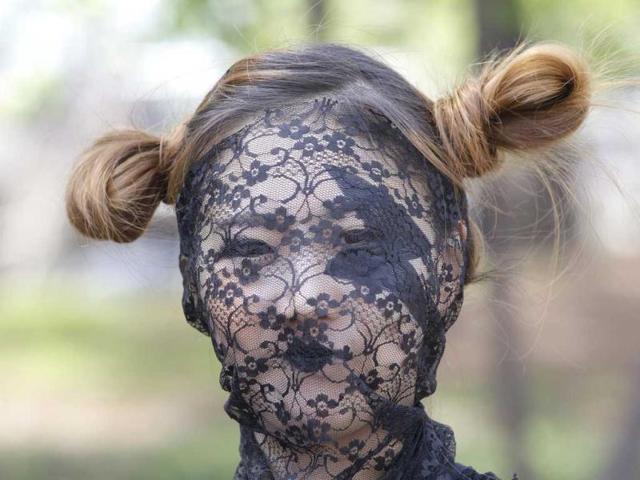 A fan dressed up as US pop diva Lady Gaga waits for Gaga's concert in front of the venue in Seoul, South Korea. AP/Lee Jin-man