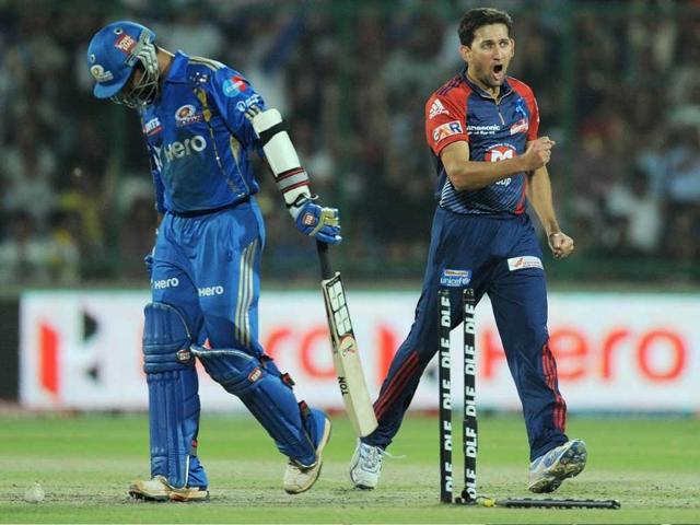 Delhi Daredevils bowler Ajit Agarkar (R) celebrates after taking the wicket of Mumbai Indians cricketer Dinesh Karthik during their IPL Twenty20 cricket match at the Ferozshah Kotla stadium in New Delhi. AFP Photo/Manan Vatsyayana