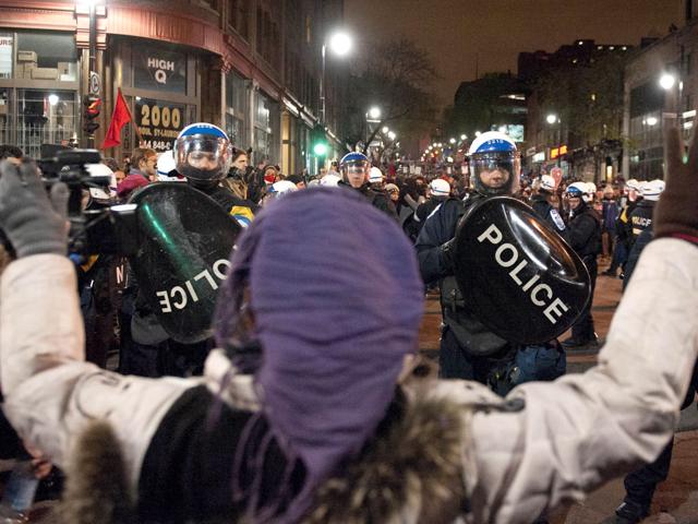 Riot police take up positions during a student protest in Montreal, Canada in response to the offer by Quebec Premier Jean Charest to stretch out a planned tuition hike over seven years instead of five in a bid to end an 11-week student protest that has included violent clashes. AFP/Rogerio Barbosa