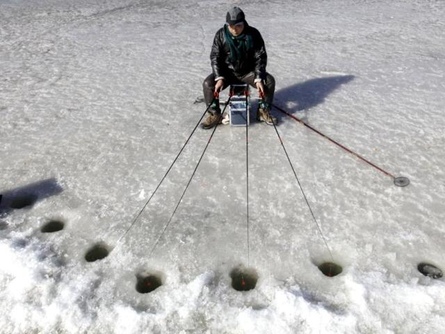 A resident fishes during an ice-fishing competition on a frozen lake in Beijing. Reuters/Jason Lee