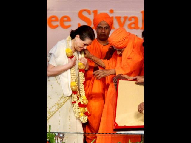 UPA chairperson Sonia Gandhi is seen with Siddaganga Math seer Sree Sree Shivakumar Mahaswamiji at Guruvandana Mahotsav organised as part of his 105th birthday celebration in Tumkur, Karnataka. PTI/Shailendra Bhojak