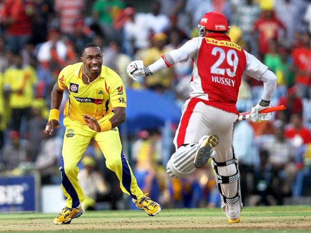 Chennai Super Kings' Dwayne Bravo and Kings XI Punjab's David Hussey in action during their IPL-5 match at MAC Stadium in Chennai. PTI/R Senthil Kumar