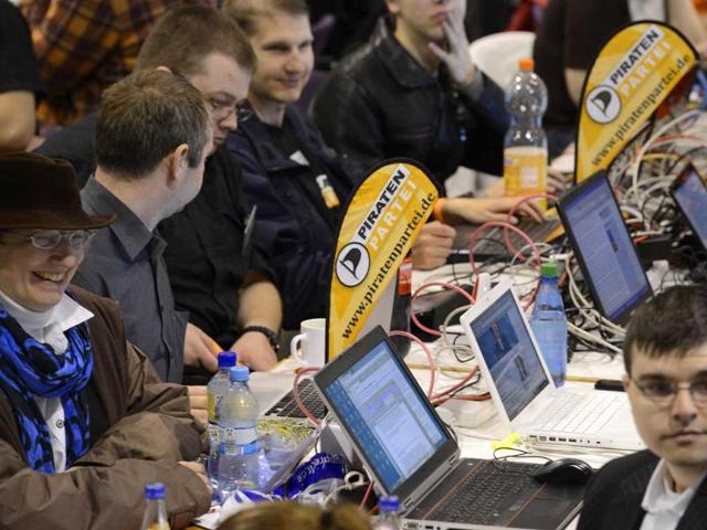 elegates of Germany's Pirate Party (Piraten Partei) use their laptops at their party convention in Neumuenster. Reuters/Fabian Bimmer
