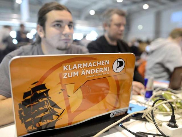 The Pirate Party started as a marginal club of computer nerds and hackers, but its appeal as an anti-establishment movement has lured many young voters to the ballot boxes, gaining it parliamentary seats in two consecutive state elections. The slogan on the laptop reads "Be ready to change!" Reuters photo/Fabian Bimmer