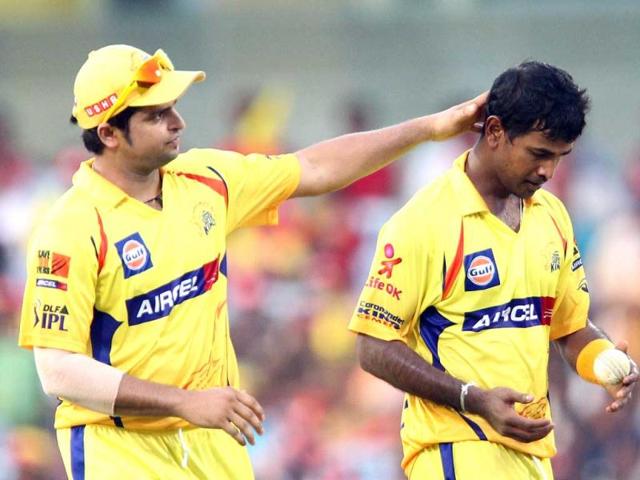 Chennai Super Kings' Suresh Raina (L) gestures as he walks next to his teammate Nuwan Kulasekara during the IPL Twenty20 cricket match against Kings XI Punjab at the MA Chidambaram Stadium in Chennai. AFP/Seshadri Sukumar