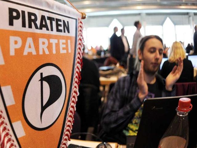 Members of German Pirate Party attend the party's two-day conference in Neumuenster, northern Germany. A new federal board of the party that flies high in the polls on a platform of Internet freedom and greater political transparency will be elected in the coming two days. AFP Photo/Angelika Warmuth