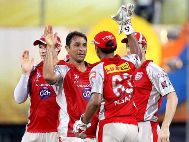 Kings XI Punjab's Azhar Mahmood celebrates along with teammates after taking the wicket of Chennai Super Kings' Faf du Plessis during their IPL-5 match at MAC Stadium in Chennai. PTI/R Senthil Kumar