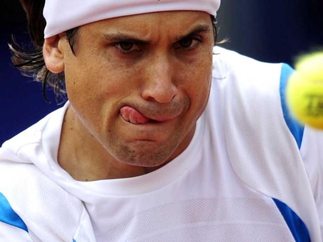David Ferrer of Spain returns the ball to Milos Raonic of Canada during their semifinal match during the Barcelona Open in Spain. AP Photo/Manu Fernandez
