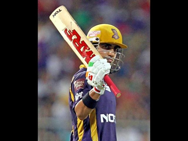 KKR captain Gautam Gambhir waves his bat on reaching 50 during IPL T20 match against Royal Challengers Bangalore at Eden Gardens in Kolkata. PTI/Ashok Bhaumik