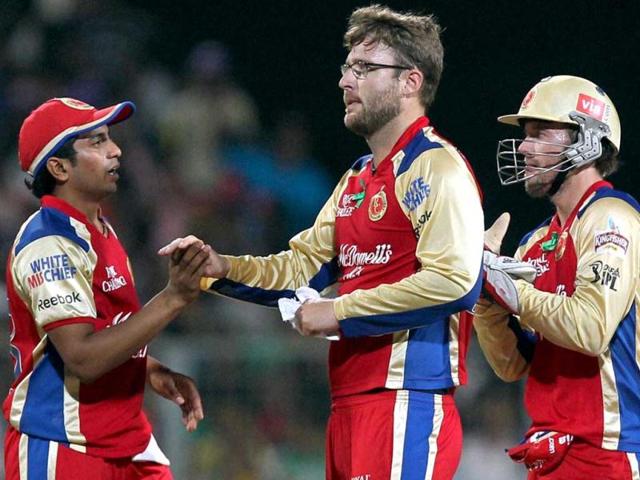 Royal Challengers Bangalore players celebrate the dismissal of Kolkata Knight Riders' Brendon McCullum during IPL5 match at Eden Gardens in Kolkata. PTI/Ashok Bhaumik